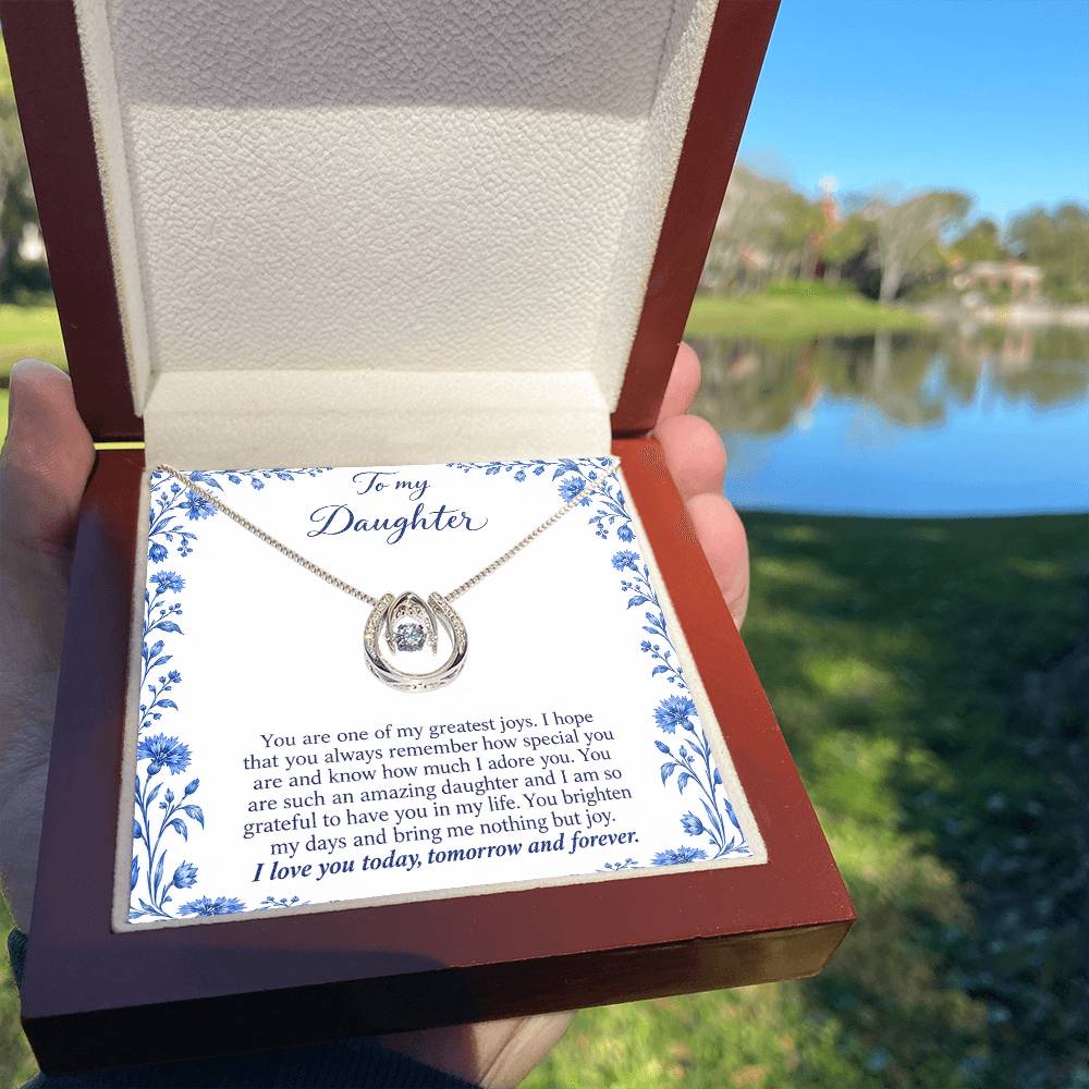 Lucky In Love teardrop necklace in white gold finish – Blue Porcelain Luxury Box held outdoors | Hensley London