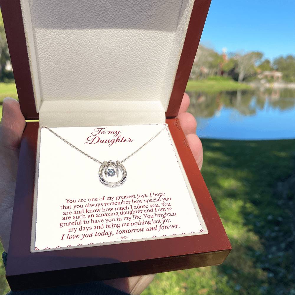 Lucky In Love teardrop necklace in white gold finish – Burgundy Letter Luxury Box held outdoors | Hensley London