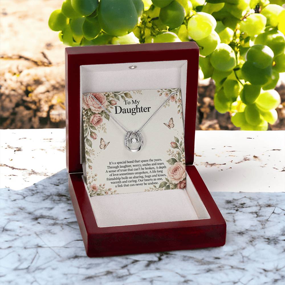 Lucky In Love teardrop necklace in white gold finish – Rose Botanical open Luxury Box outdoors | Hensley London