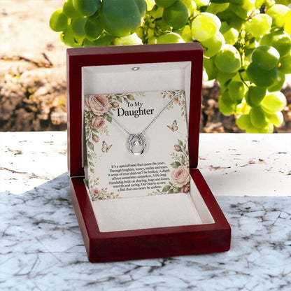 Lucky In Love teardrop necklace in white gold finish – Rose Botanical open Luxury Box outdoors | Hensley London
