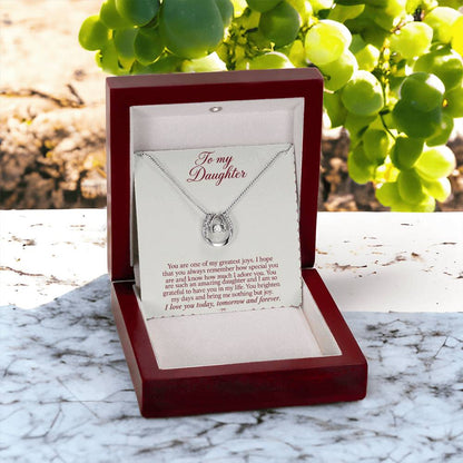 Lucky In Love teardrop necklace in white gold finish – Burgundy Letter open Luxury Box outdoors | Hensley London