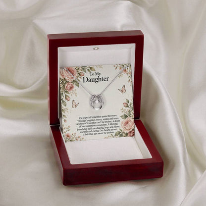 Lucky In Love teardrop necklace in white gold finish – Rose Botanical open Luxury Box on fabric | Hensley London