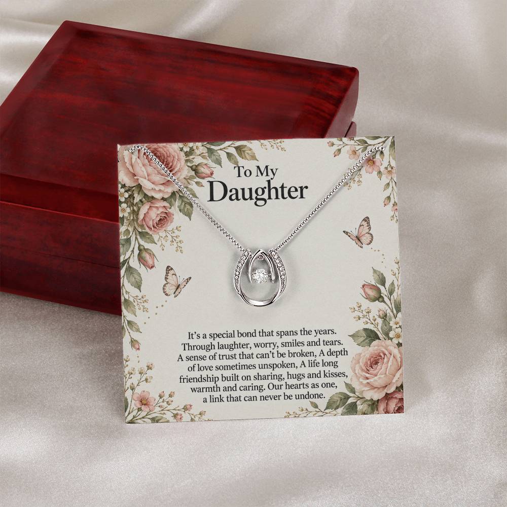 Lucky In Love teardrop necklace in white gold finish – Rose Botanical message card beside Luxury Box | Hensley London