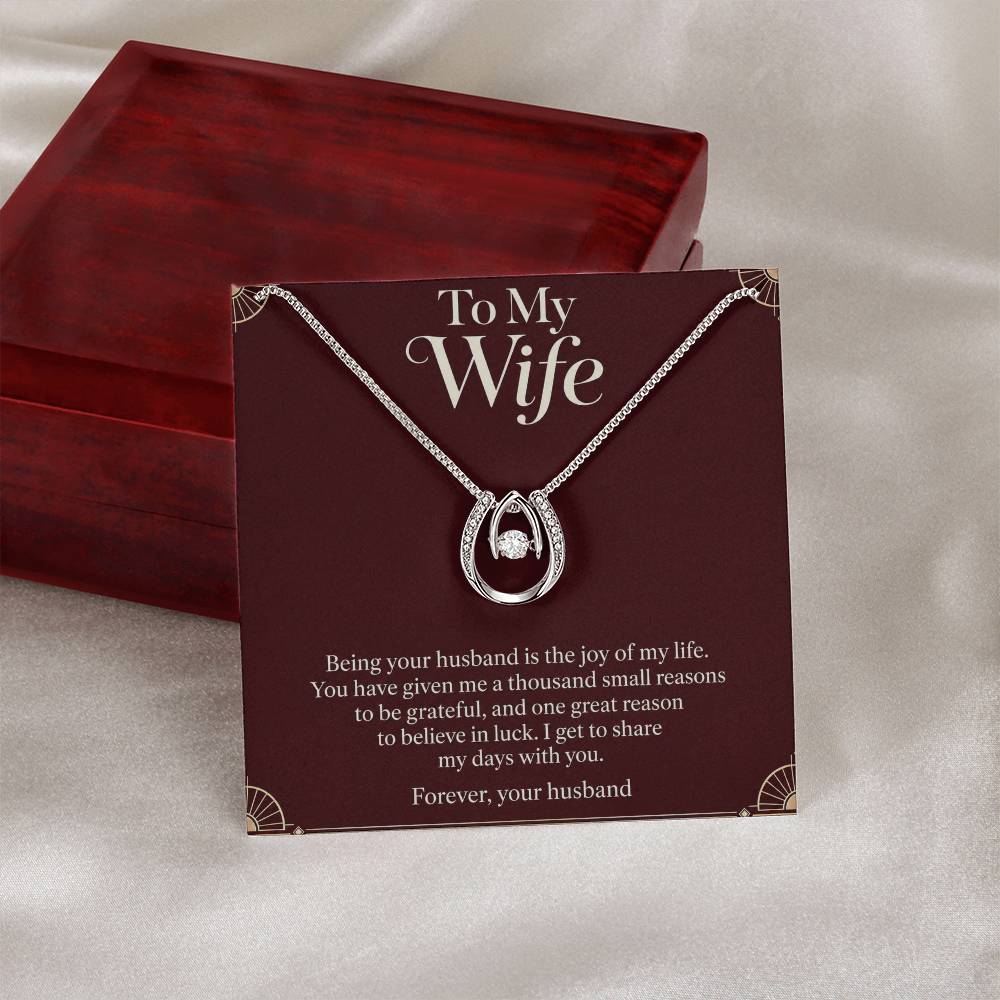 Lucky In Love necklace and Wife message card beside closed luxury box | Hensley London