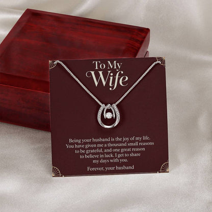 Lucky In Love necklace and Wife message card beside closed luxury box | Hensley London