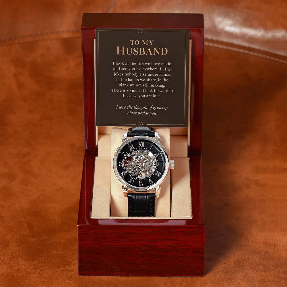 Black leather openwork watch for husband – open gift box with message card on brown leather | Hensley London