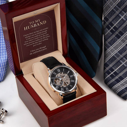 Black leather openwork watch for husband – angled gift box beside a necktie | Hensley London
