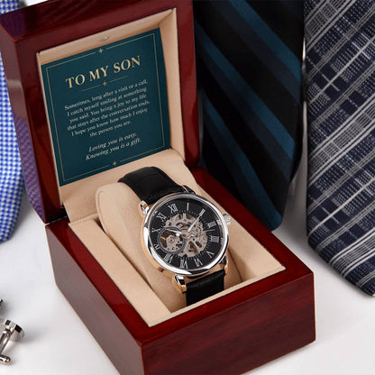 Black leather openwork watch for son – angled gift box beside a necktie | Hensley London