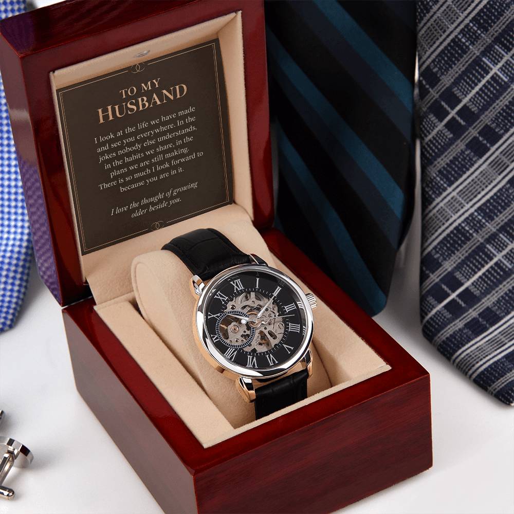 Black leather openwork watch for husband – angled gift box beside a necktie | Hensley London