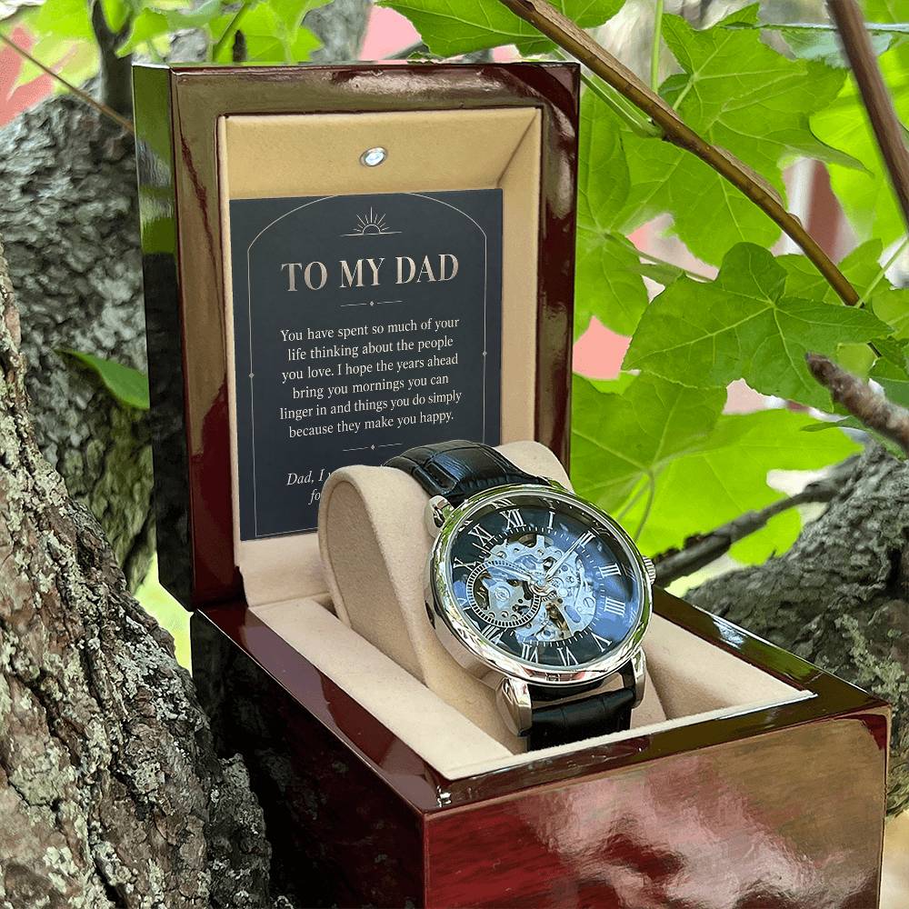 Black leather openwork watch for father – open gift box among foliage | Hensley London
