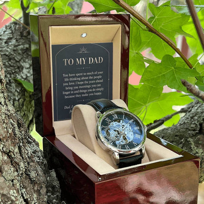 Black leather openwork watch for father – open gift box among foliage | Hensley London