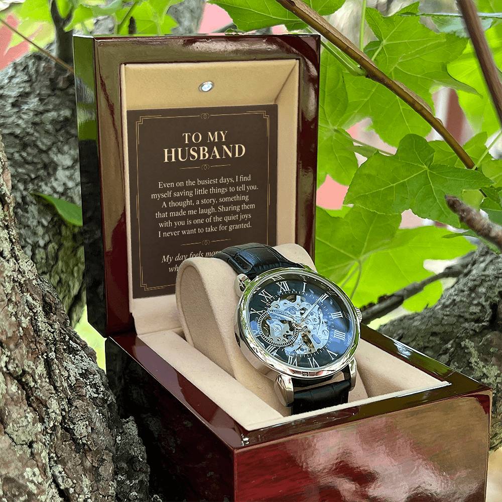 Black leather openwork watch for husband – open gift box among foliage | Hensley London