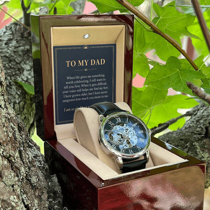 Black leather openwork watch for father – open gift box among foliage | Hensley London