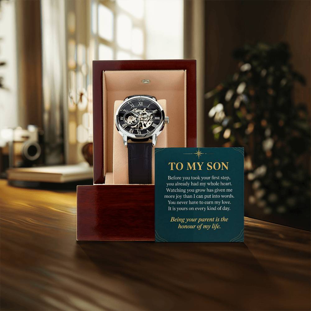 Black leather openwork watch for son – gift box and message card on a tabletop | Hensley London