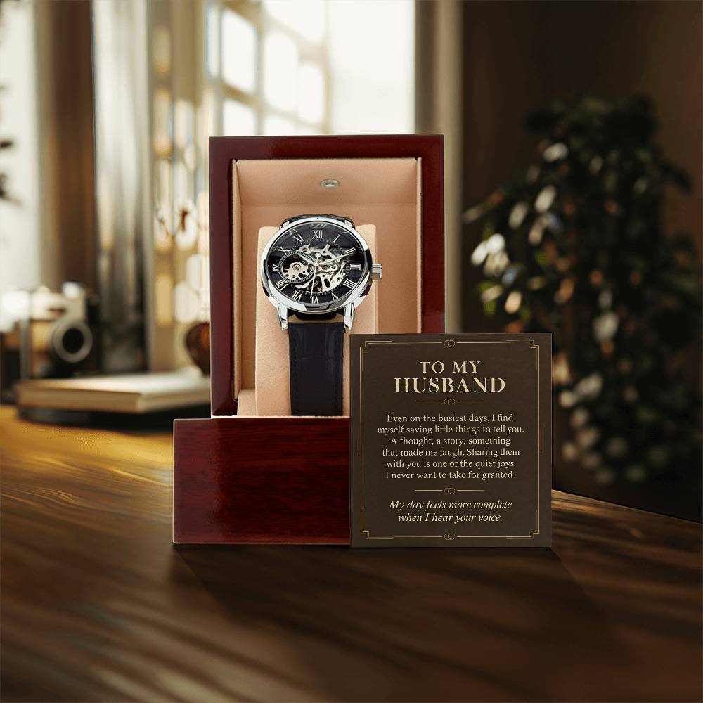 Black leather openwork watch for husband – gift box and message card on a tabletop | Hensley London