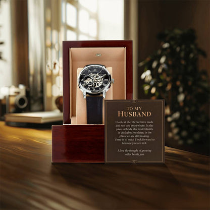 Black leather openwork watch for husband – gift box and message card on a tabletop | Hensley London