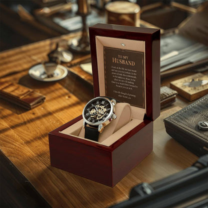 Black leather openwork watch for husband – watch and message card in a gift box on a desk | Hensley London