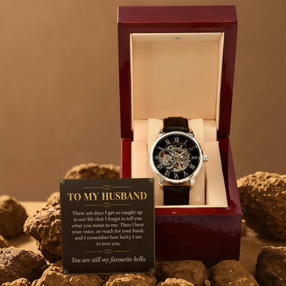 Black leather openwork watch for husband – gift box and message card on a rocky backdrop | Hensley London