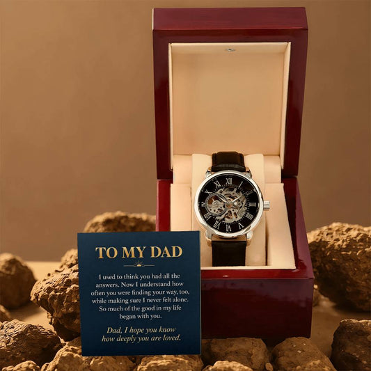 Black leather openwork watch for father – gift box and message card on a rocky backdrop | Hensley London