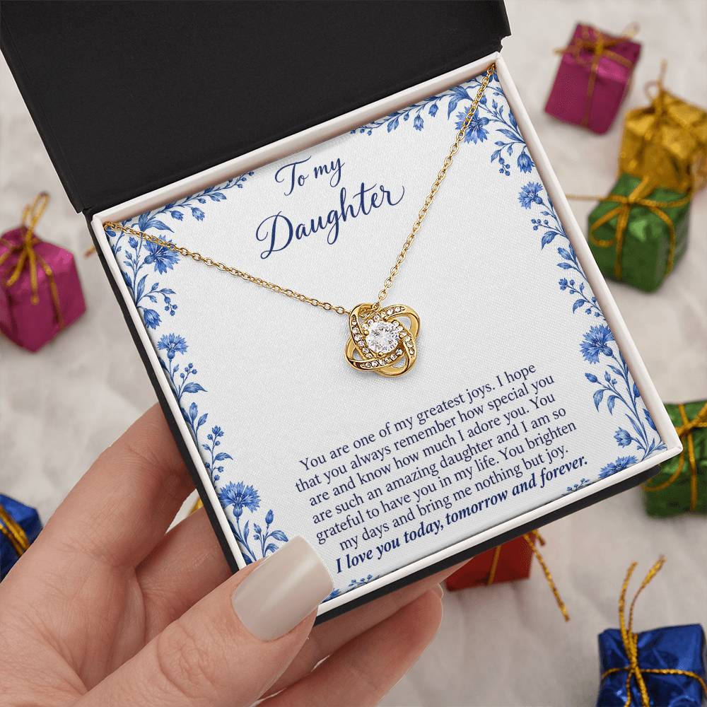 Love Knot necklace with Blue Porcelain daughter message card – yellow gold finish necklace in Standard Box held in hand | Hensley London