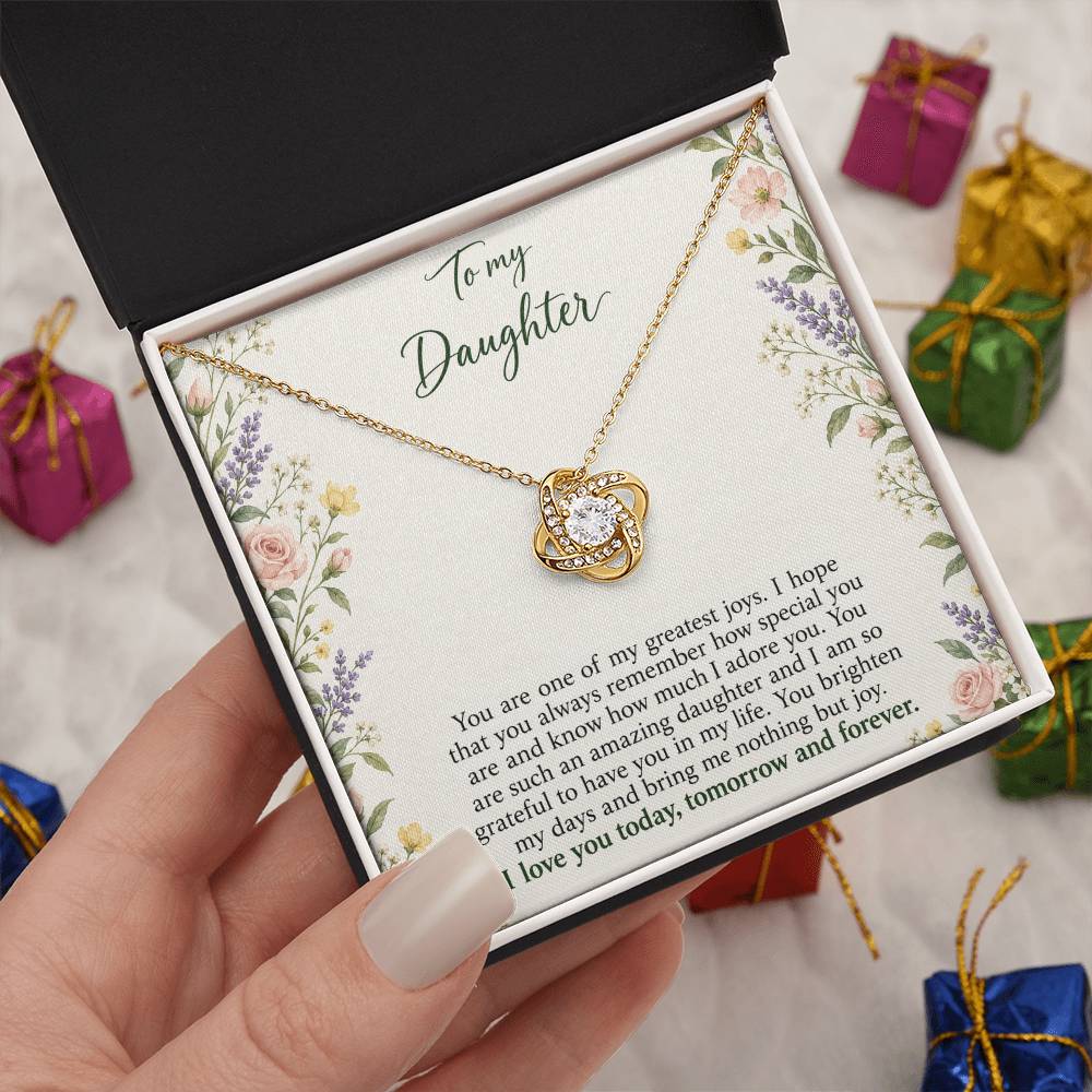 Love Knot necklace with Heirloom Garden daughter message card – yellow gold finish necklace in Standard Box held in hand | Hensley London