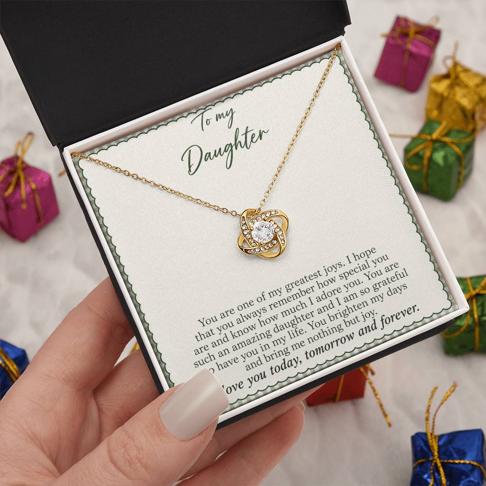 Love Knot necklace with Sage Gingham daughter message card – yellow gold finish necklace in Standard Box held in hand | Hensley London