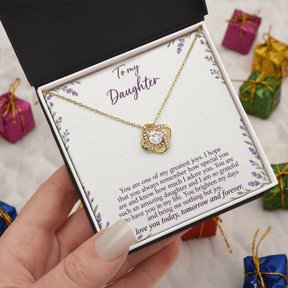 Love Knot necklace with Lavender Meadow daughter message card – yellow gold finish necklace in Standard Box held in hand | Hensley London