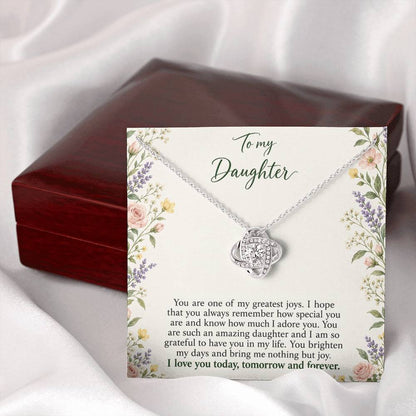 Love Knot necklace with Heirloom Garden daughter message card – white gold finish necklace and card beside Luxury Box | Hensley London