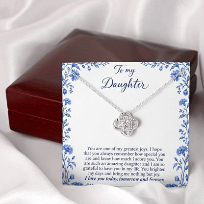 Love Knot necklace with Blue Porcelain daughter message card – white gold finish necklace and card beside Luxury Box | Hensley London