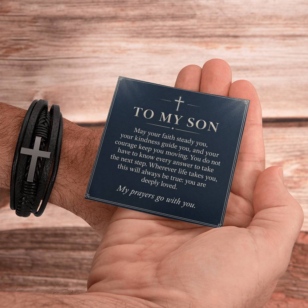 Cross Bracelet in Black for Son – handheld message card beside bracelet | Hensley London