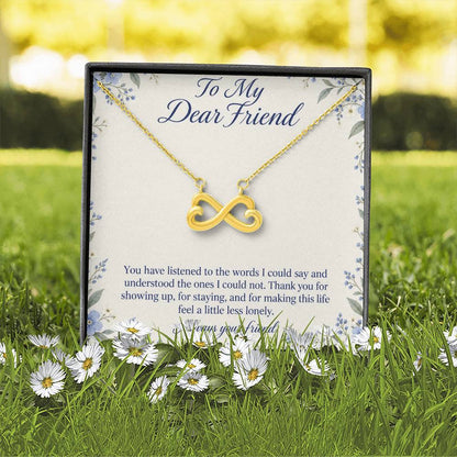 Yellow-gold Endless Love infinity necklace and Friend message card in standard box outdoors | Hensley London
