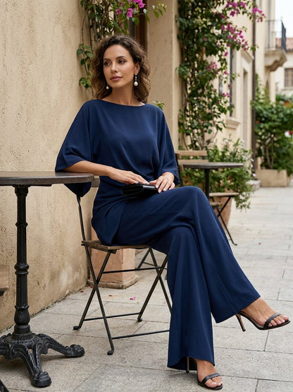 Women's Draped Blouse and Wide-Leg Pants Two-Piece Set in Navy Blue - seated styling view | Hensley London