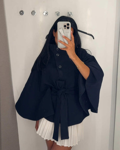 Women's High-Neck Belted Cape Jacket in Navy - lifestyle view | Hensley London