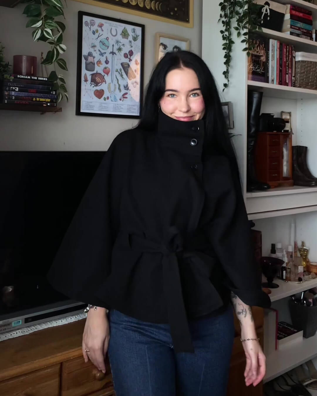 Women's High-Neck Belted Cape Jacket in Black - lifestyle view | Hensley London