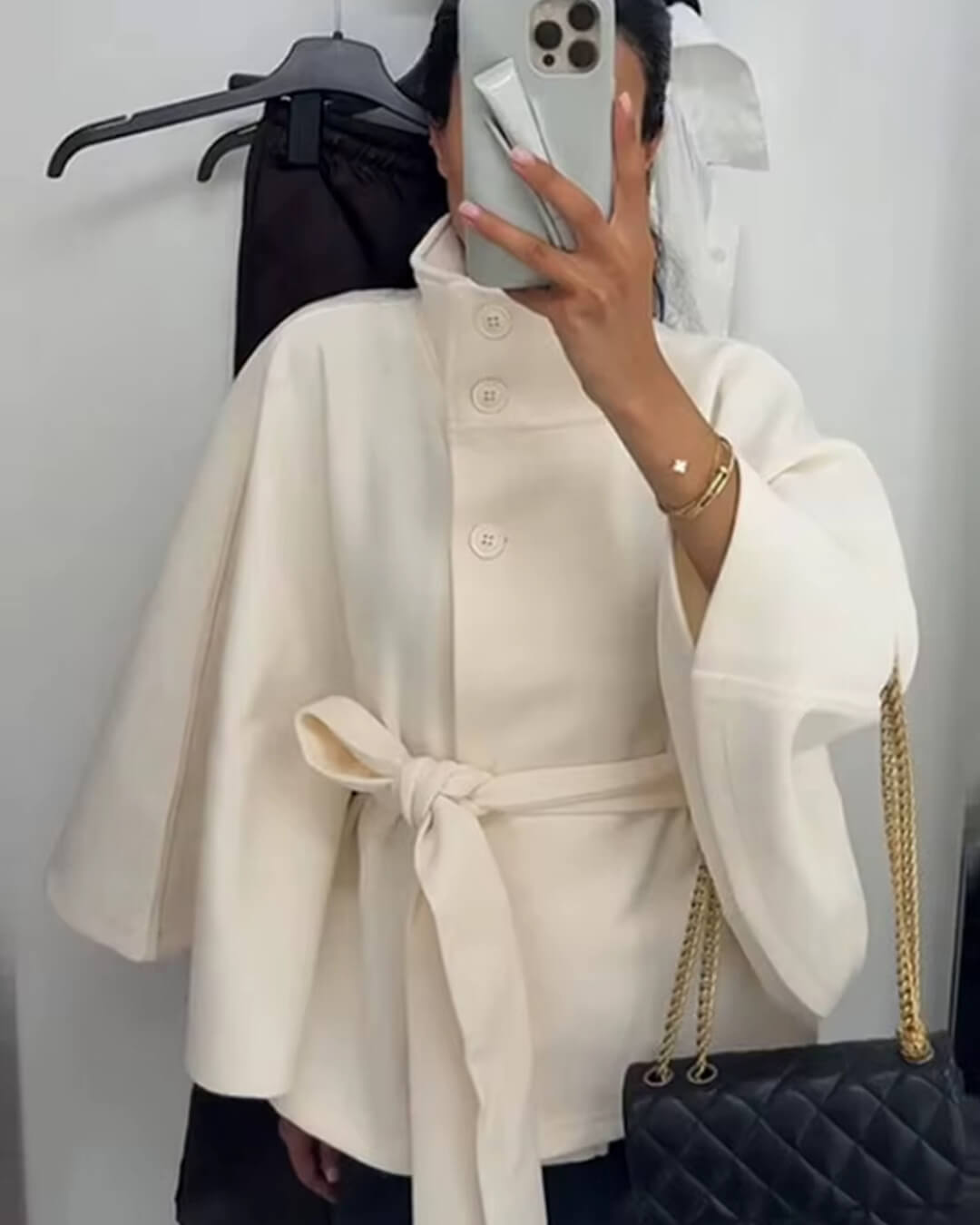 Women's High-Neck Belted Cape Jacket in White - lifestyle view | Hensley London