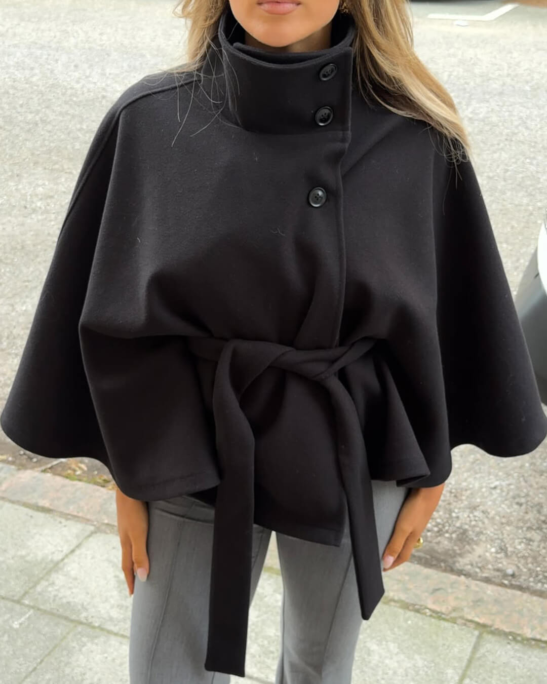Women's High-Neck Belted Cape Jacket in Black - front view | Hensley London