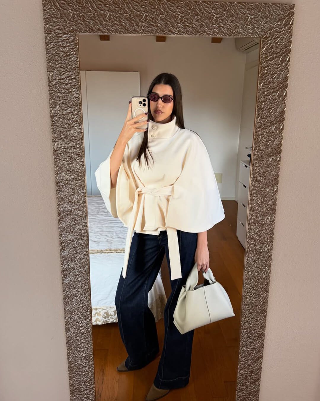 Women's High-Neck Belted Cape Jacket in White - lifestyle view | Hensley London