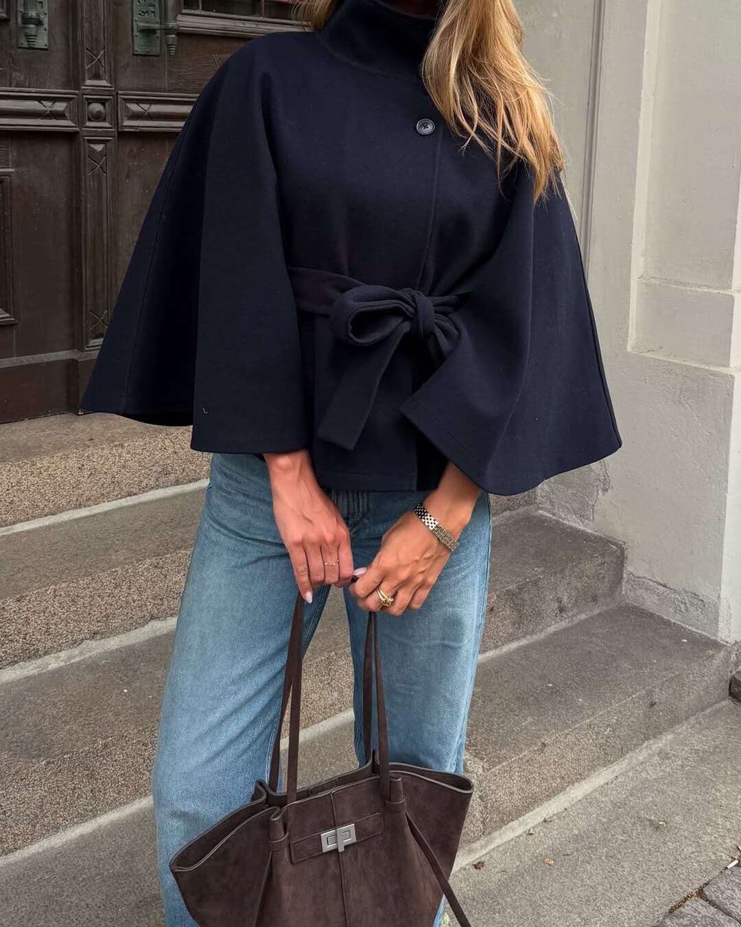 Women's High-Neck Belted Cape Jacket in Navy - lifestyle view | Hensley London
