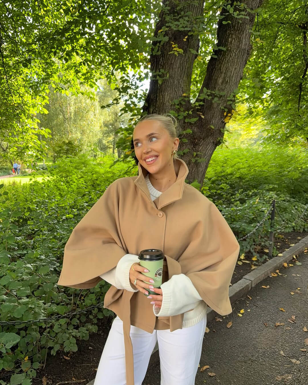 Women's High-Neck Belted Cape Jacket in Beige - lifestyle view | Hensley London
