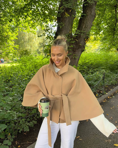 Women's High-Neck Belted Cape Jacket in Beige - lifestyle view | Hensley London
