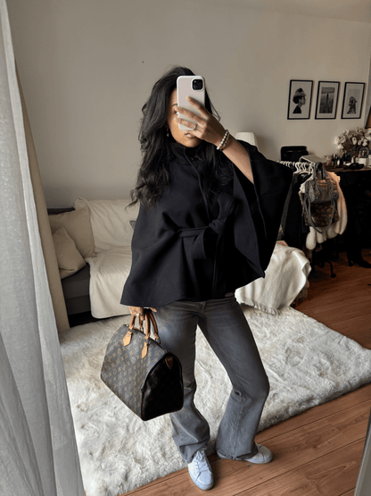 Women's High-Neck Belted Cape Jacket in Black - lifestyle view | Hensley London