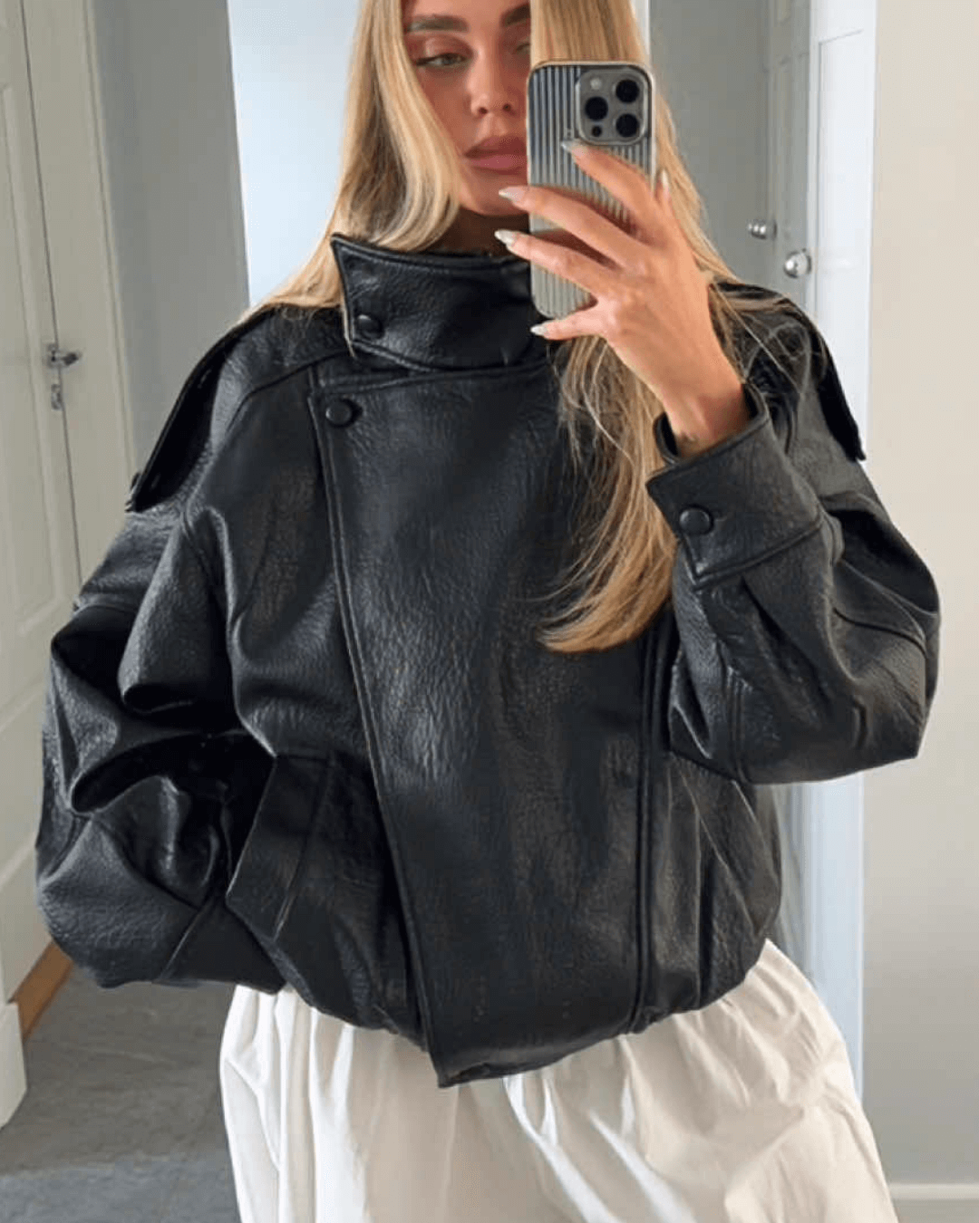Women's Vegan Leather Asymmetrical Zip Jacket in Black - lifestyle view | Hensley London