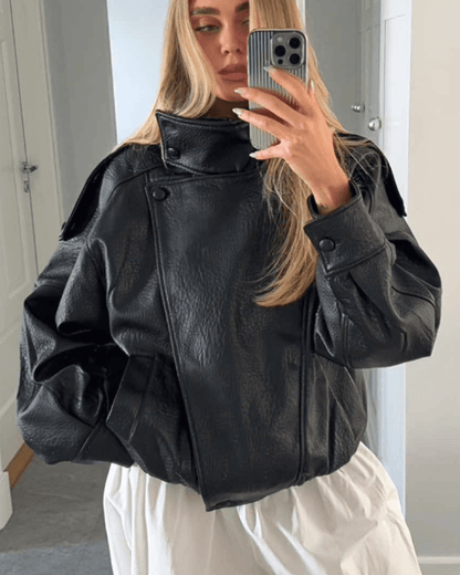 Women's Vegan Leather Asymmetrical Zip Jacket in Black - lifestyle view | Hensley London