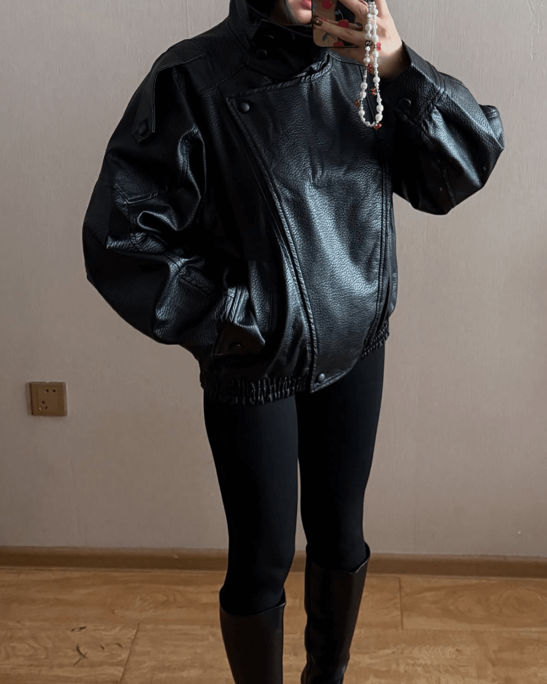 Women's Vegan Leather Asymmetrical Zip Jacket in Black - lifestyle view | Hensley London