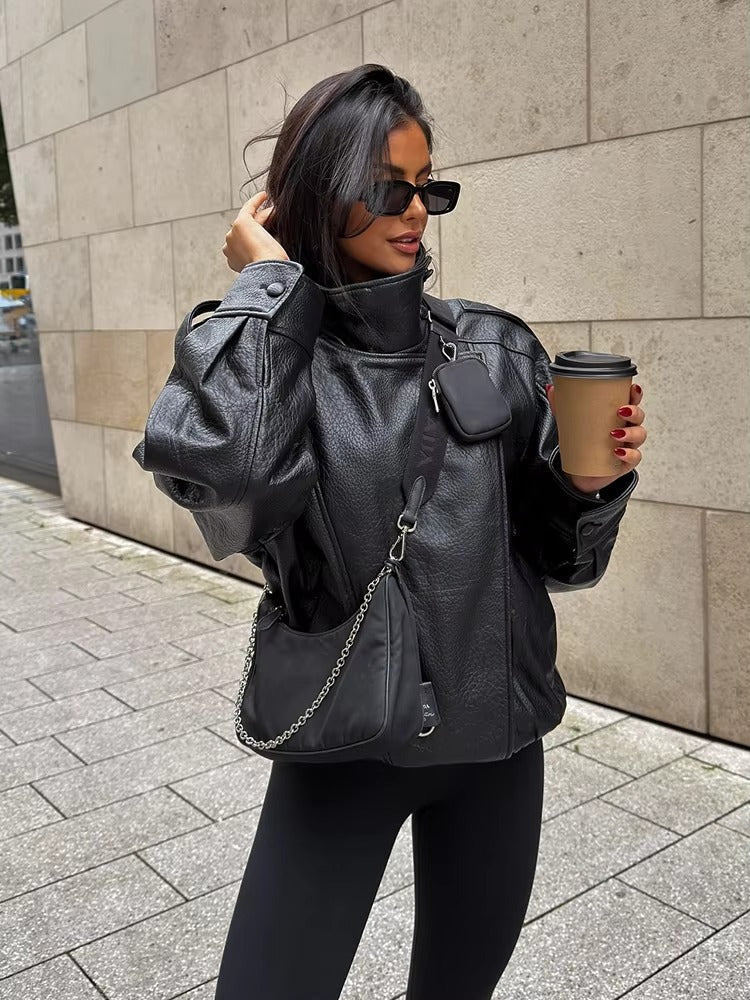 Women's Vegan Leather Asymmetrical Zip Jacket in Black - lifestyle view | Hensley London