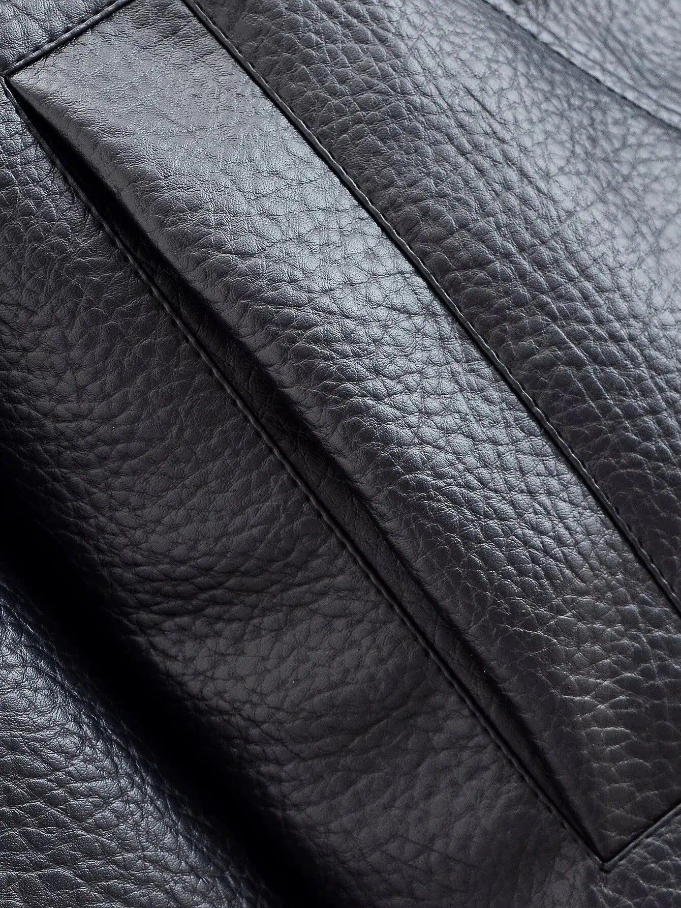 Women's Vegan Leather Asymmetrical Zip Jacket in Black - fabric detail | Hensley London