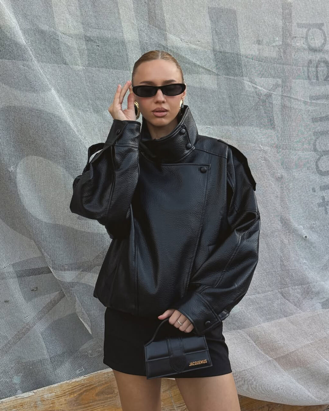 Women's Vegan Leather Asymmetrical Zip Jacket in Black - lifestyle view | Hensley London