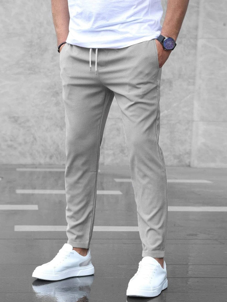 Men's Drawstring Tapered Trousers with Elasticated Waist in Gray – front view on model | Hensley London