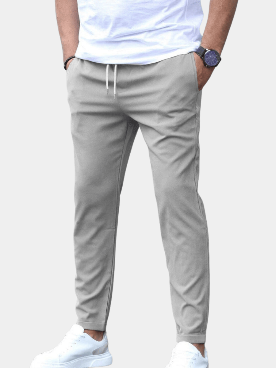 Men's Drawstring Tapered Trousers with Elasticated Waist in Gray – front view on model | Hensley London