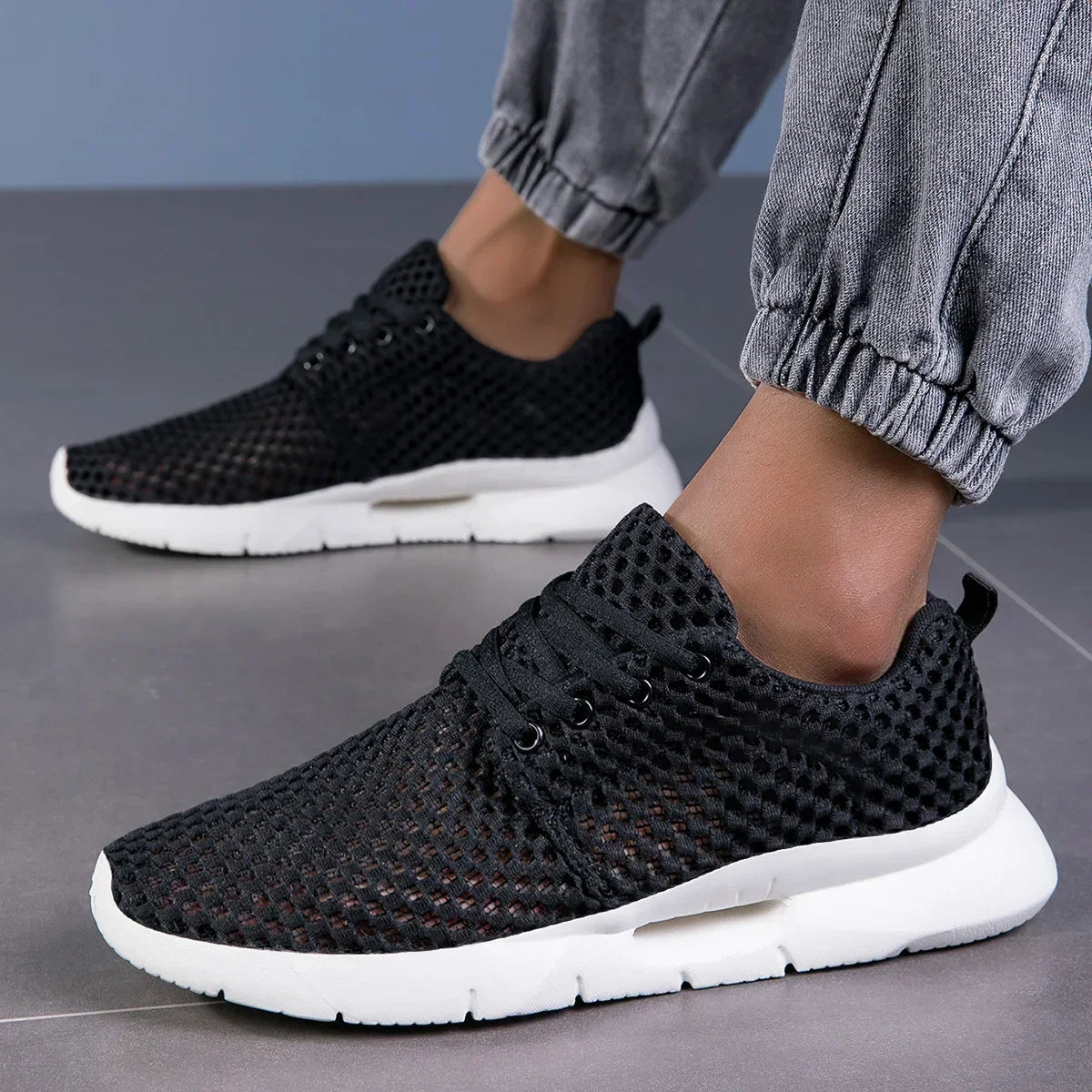 Men's Mesh Lace-Up Trainers in Black – on-foot side view | Hensley London